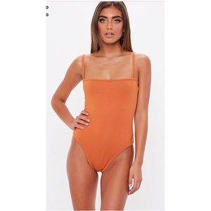 rust straight neck ribbed bodysuit